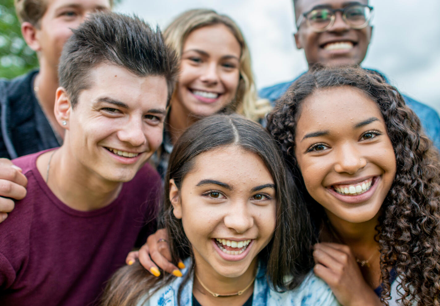 A group of friends together smiling