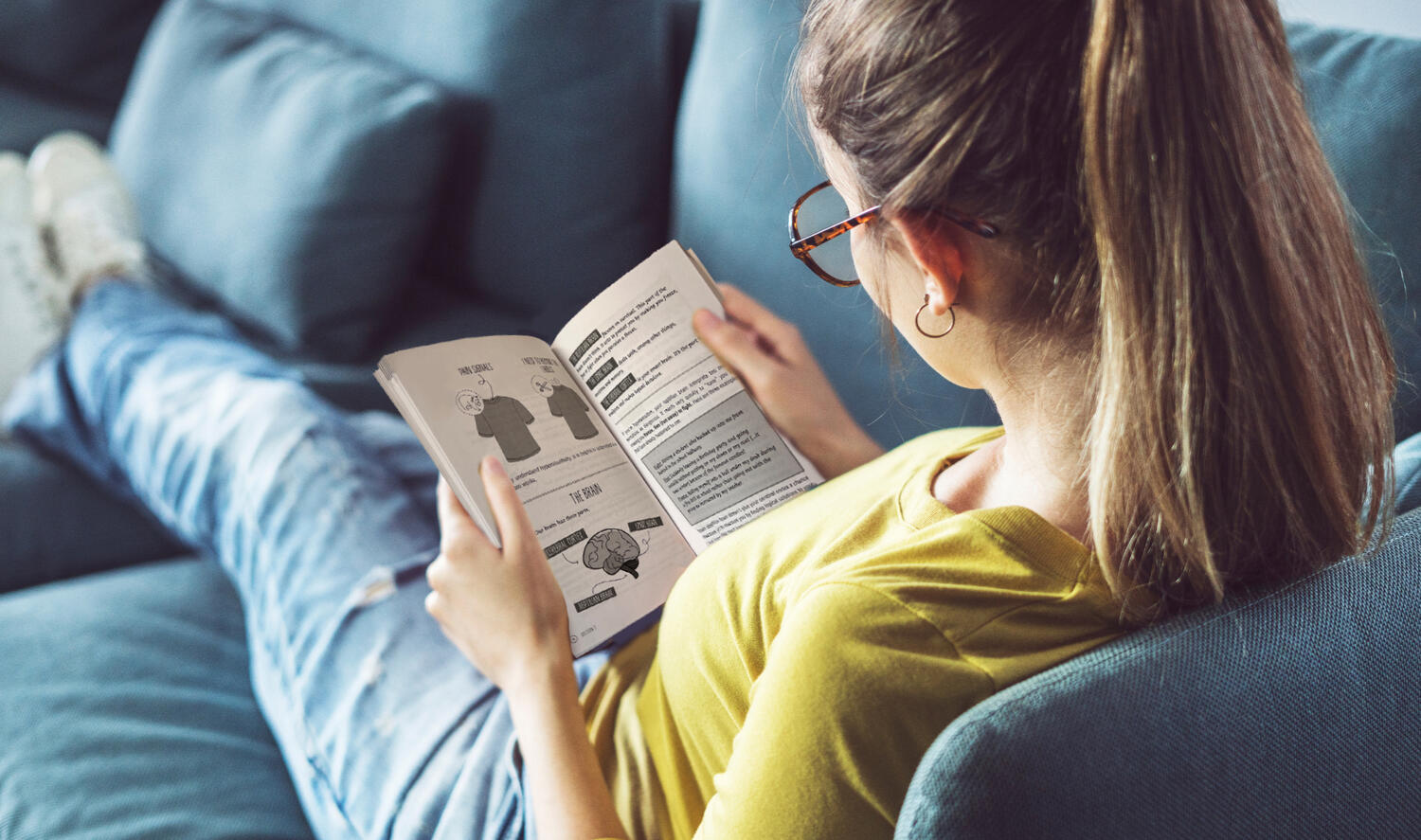 Girl reading book about autism