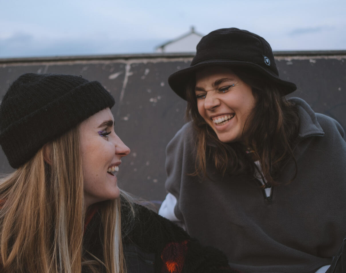 Two girls laughing together
