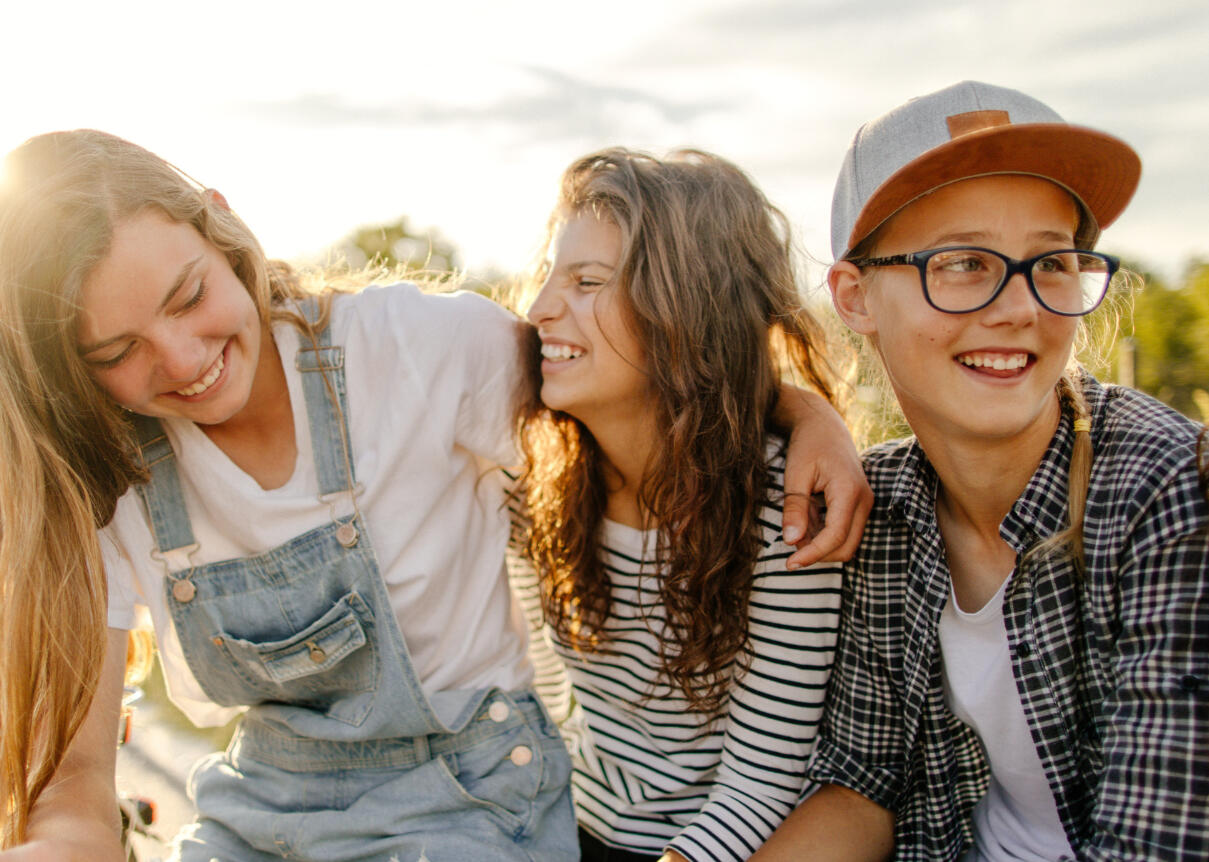 Girls on the autism spectrum sitting together laughing